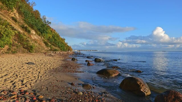 Redlowska beach with boulder rocks in water at the Baltic in Gdynia Redlowo, Poland.