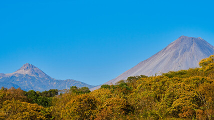 Colima volcano on a clear day with blue skies