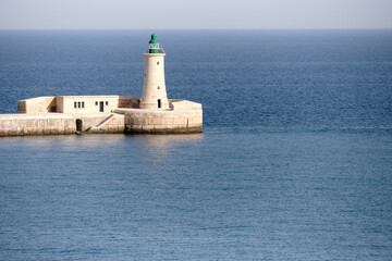 Red lighthouse near Fort Ricasoli East Breakwater