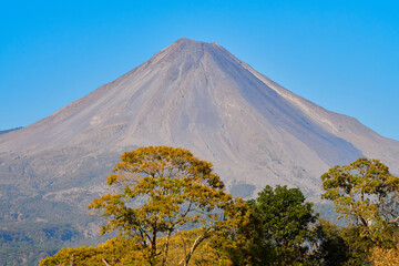 Road leading to the Colima volcano amidst a scenery