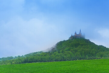 Fototapeta na wymiar Landscape and Hohenzollern castle in haze