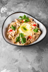 Fried rapana meat in cream sauce with mashed potato