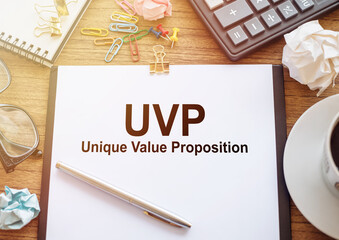 Unique Value Proposition - UVP text on business paper on office desk