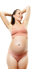 Happy relaxed pregnant woman in body color underwear