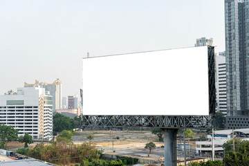 Blank white billboard on city background. Public ad and business concept. Mock up