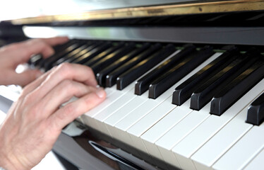 Fototapeta premium Hands playing music on piano