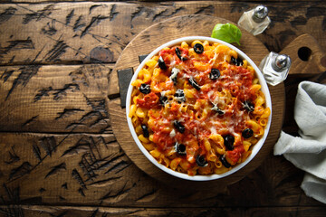 Homemade pasta bake with olives and tomato
