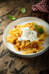 Pasta with tomatoes and fresh cheese