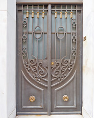 A vintage houses ornate forged door, beautiful handcrafted, everyday art objects. Travel in Athens, Greece.