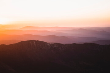 Horizontal view of beautiful layers of mountains with golden light at sunset in Las Villuercas, Cáceres, Extremadura, Spain