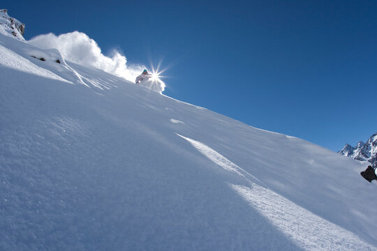 A skier carves in perfect powder in Chile.