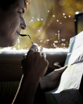 Close up of a woman reading a map.