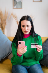 Fototapeta premium Woman with smartphone and credit card shopping online