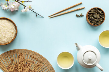 Asian tabble set with tan and cherry blossom branch, top view