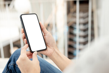 cell phone blank white screen mockup.hand holding texting using mobile on desk at office.background empty space for advertise.work people contact marketing business,technology