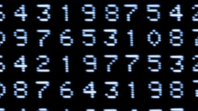 Numbers and code written on computer screen