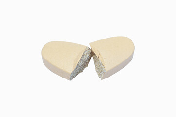 Pill cream color drug broken down put place isolated on white background. Light yellow pills oval. Vitamin supplements for body are commonly used all over world. healthy science concept. 