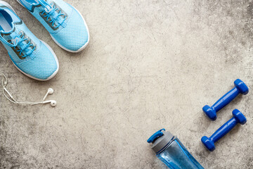 Sneakers and bottle shaker - workout flatlay, top view