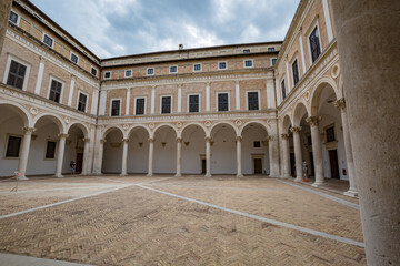Fototapeta na wymiar Beautiful places of Italy. View of renaissance courtyard of the Ducal Palace of Urbino , city and World Heritage Site in Marche region, Italy.