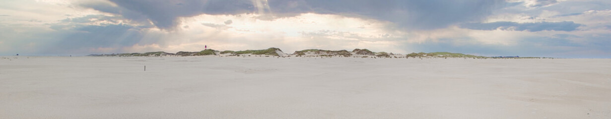 Wide panorama from the beach of Amrum at sunset 