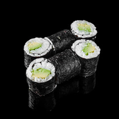 maki sushi roll with avocado on a black mirror background