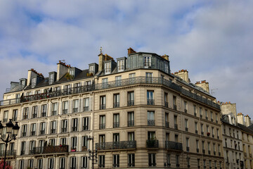 Fototapeta na wymiar typical haussmannian facade , parisian ornamented building real estate property