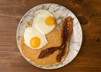 Eggs, bacon and pancakes