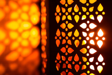 candlelight inside a decorative lantern at night