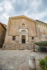Fototapeta na wymiar View of entrance of San Domenico church in Urbino historic center - Unesco World Heritage site and an apex of Renaissance architecture.