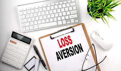 LOSS AVERSION text on white paper. the inscription on the notebook