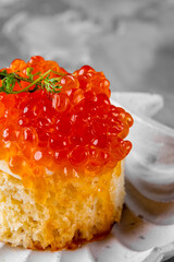 Canape with brioche, butter, salmon red caviar.