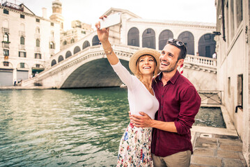 Romantic young couple enjoying vacation in Venice, Italy