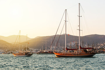 Bodrum cruise port with  sailing yachts at sunset. Beautiful view of Bodrum marina at sunset.