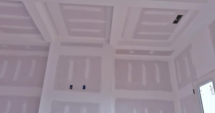 After plastering drywalling of new house under construction has been completed, it is now time to paint an unfinished house.