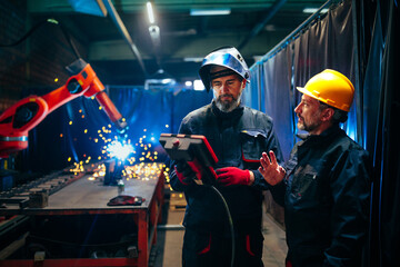 Welder with supervisor.