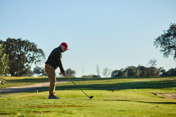 senior man playing golf