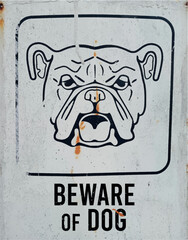 Beware of dog on vintage rusty metal sign on a white background, vector design