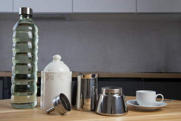 a set for making delicious moko coffee at home in the kitchen. Water, coffee, cup, geyser coffee machine