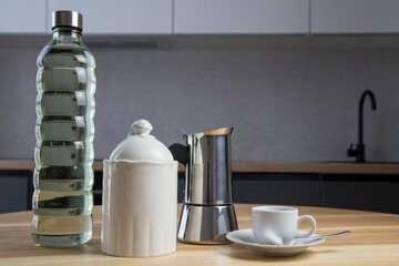 a set for making delicious moko coffee at home in the kitchen. Water, coffee, cup, geyser coffee machine