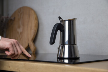 Young woman prepares coffee with mocha Cheerful girl in the kitchen prepares coffee on the...