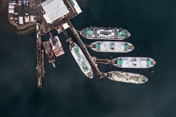 Bainbridge Island, USA - Feb. 23. Vertical aerial view of WA State Ferry Maintenance Facility located in Eagle Harbor on Bainbridge Island, with ferry boats moored at the pier 