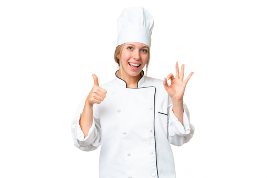 Young chef woman over isolated chroma key background showing ok sign and thumb up gesture