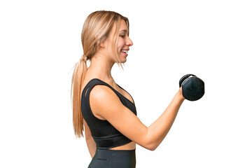 Blonde sport woman making weightlifting over isolated chroma key background with happy expression