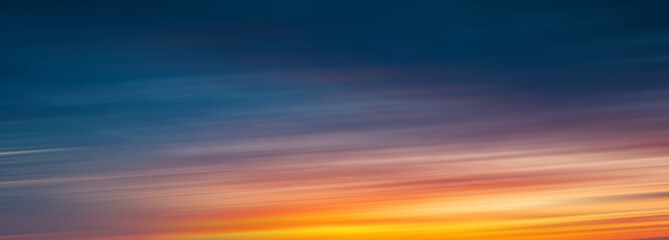 Abstract gradient sunrise in the sky with blue and orange natural background.