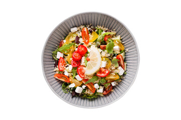 Isolated fresh salad with couscous, tomato, feta cheese 
 and herbs, top view