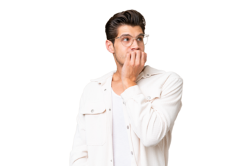 Young handsome caucasian man over isolated background is a little bit nervous