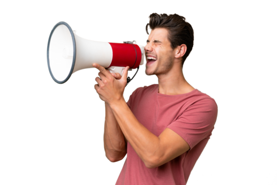 Young handsome caucasian man over isolated background shouting through a megaphone