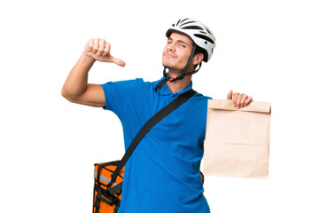 Young caucasian man taking a bag of takeaway food over isolated background proud and self-satisfied