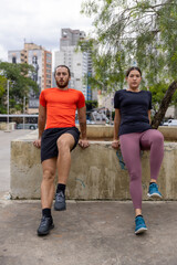 Brazil,Sao Paulo, Man and woman exercising in park