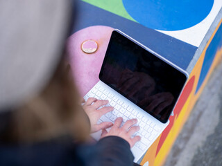 Woman using digital tablet on wall © Cultura Creative